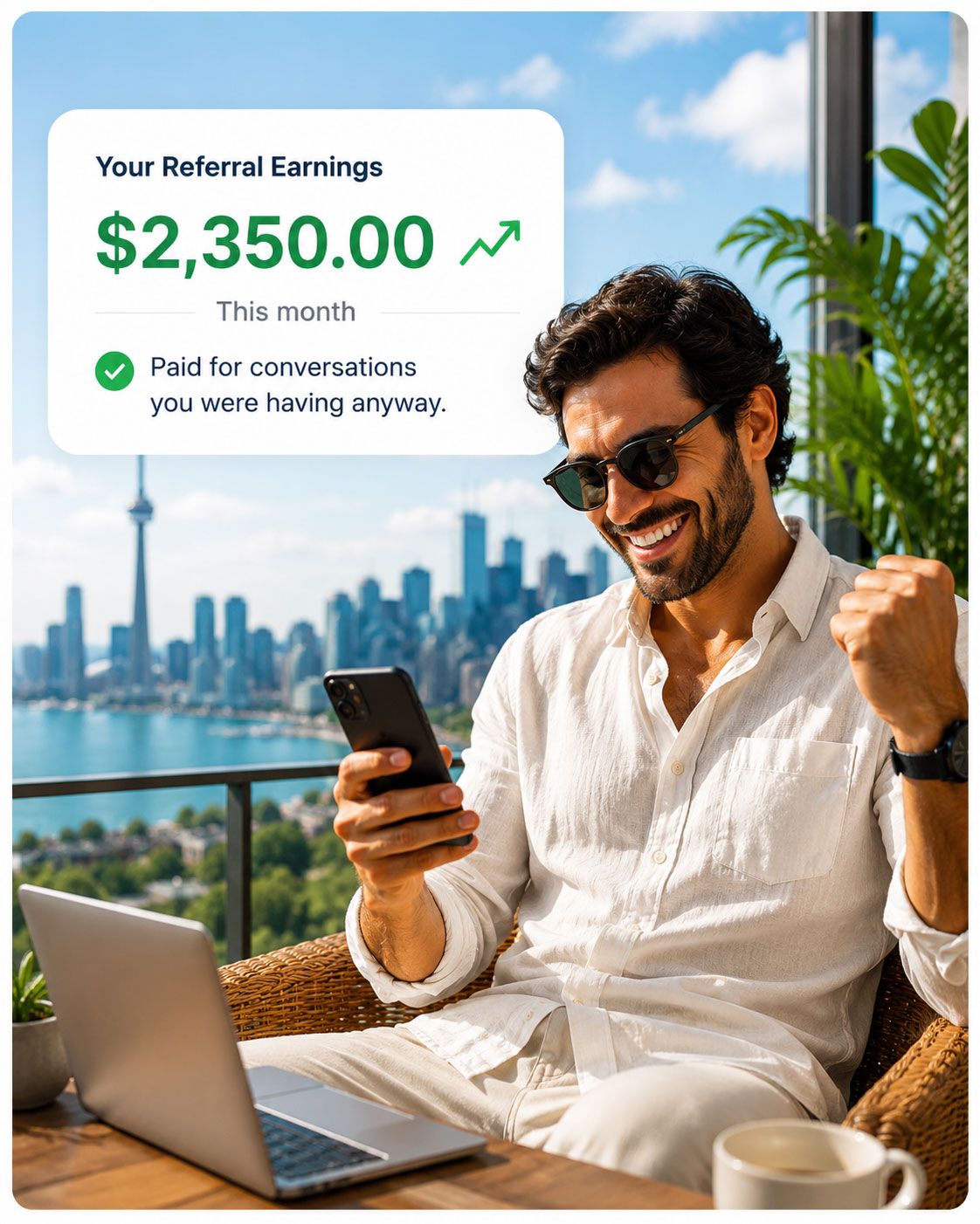 A Global Hire referral partner checking his phone on a balcony overlooking the Toronto skyline